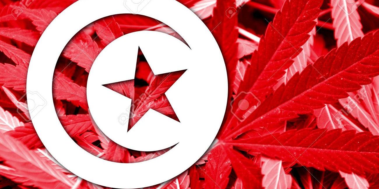 Tunisia Flag on cannabis background. Drug policy. Legalization of marijuana